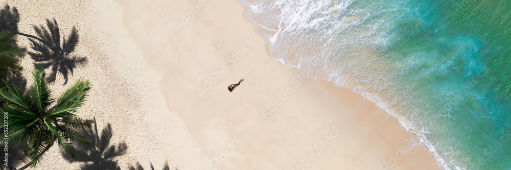 Aerial Drone View of Tropical Beach Paradise with Palm Trees and Woman