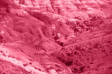 Acrylglasbilder Pantone 2023 Viva Magenta Trendy Color of the year 2023: Viva Magenta toned aerial drone view of eroded landform of Altai mountains  © olinchuk