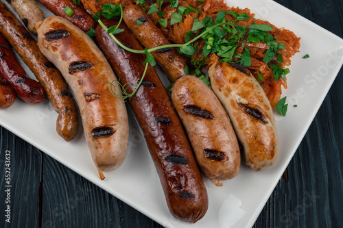 Grilled different sausage w...