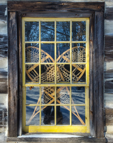 Snow shoes in a window