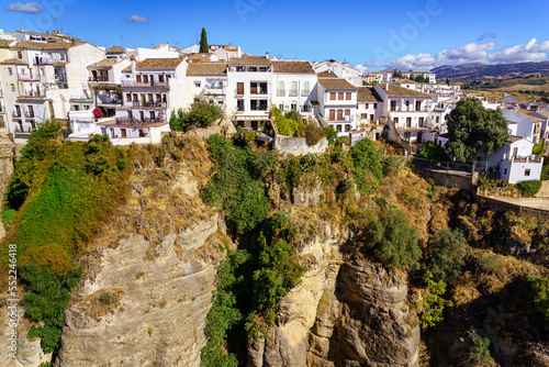 Andalusian village of white houses hanging from the gorge that forms the erosion of the river, Ronda Malaga.