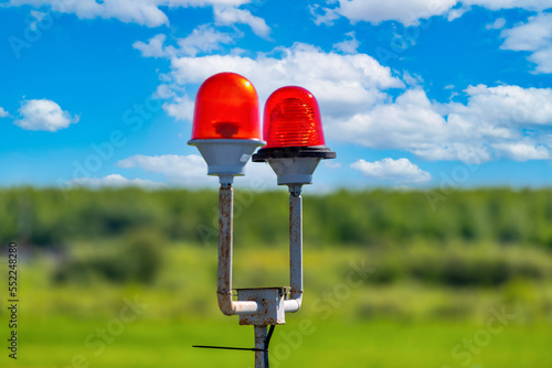 Red aviation aeronautical lights, warning signals on the airfield for aircraft flights.