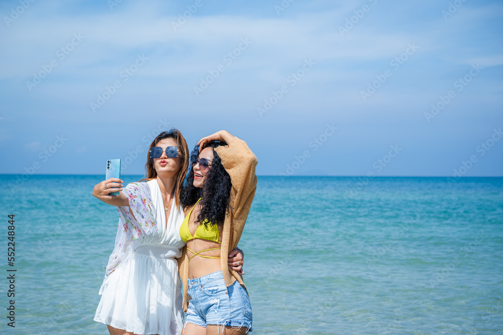 Two Asian beautiful girls happy together on the beach,Holiday in summer. Two Asian beautiful girls happy together on the beach,Holiday in summer.