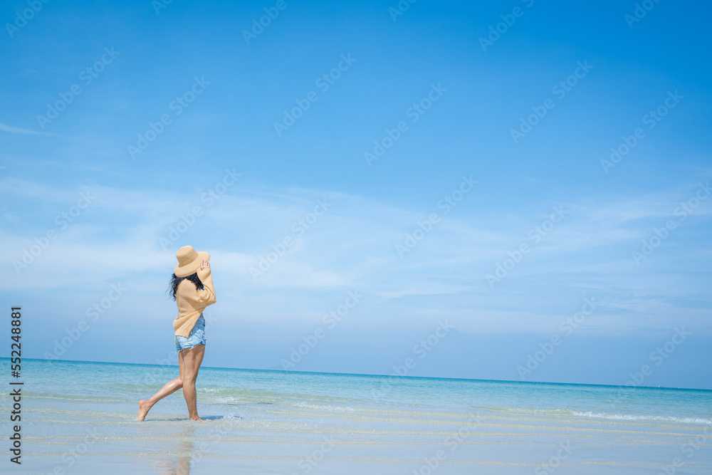 Happy carefree woman enjoying beautiful sea on the beach,Summer holidays concept. Happy carefree woman enjoying beautiful sea on the beach,Summer holidays concept.