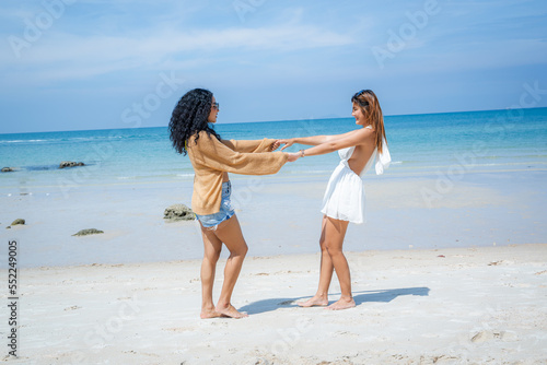 Happy female friends enjoy and fun outdoor activity lifestyle on holiday travel vacation at the sea,Friendship,Sea,Holidays,Gesture and people concept.