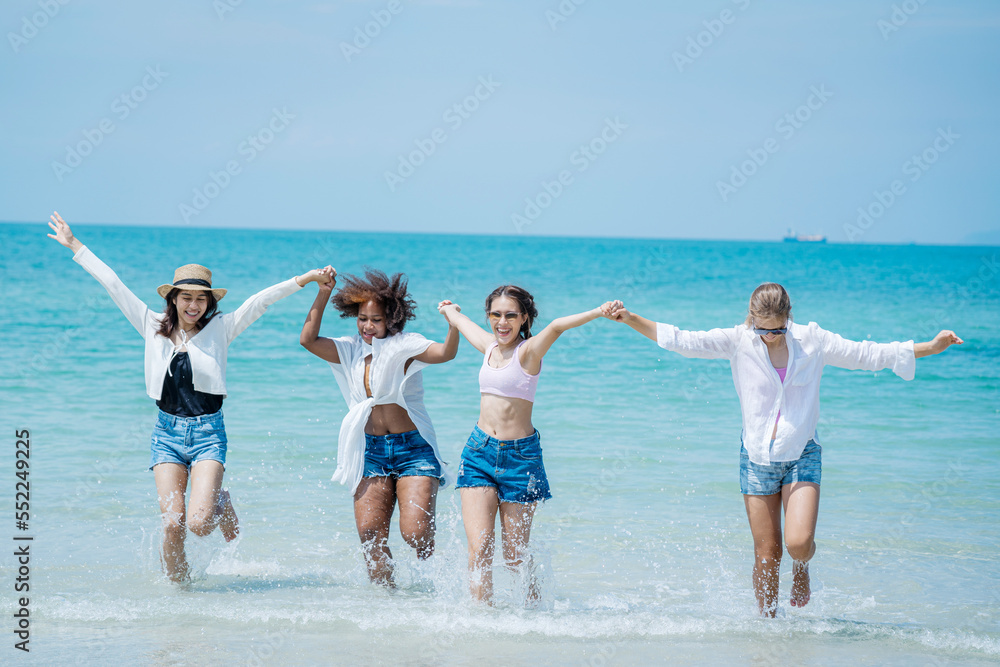 Beautiful girls and friend having fun together on the beach,Nice weather in travel and holiday concept. Beautiful girls and friend having fun together on the beach,Nice weather in travel and holiday concept.