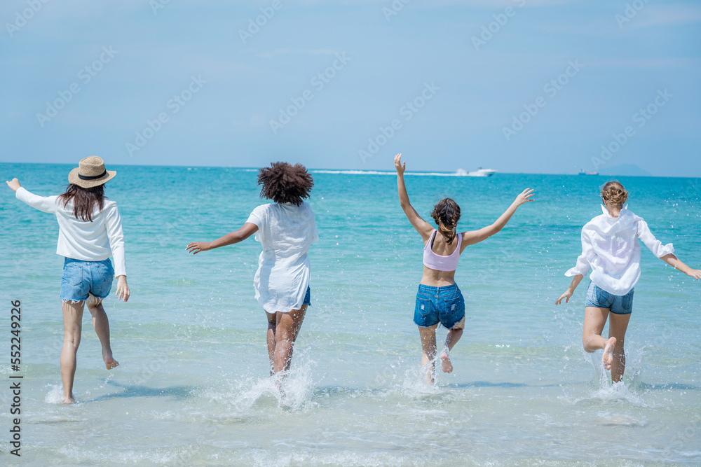 Group of friends having fun at the beach on holidays,Holiday in summer,Concept vacation.