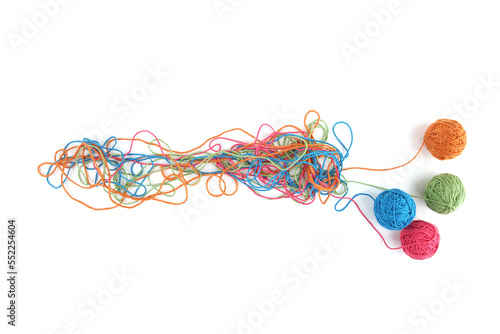 Fototapeta Tangled colorful cotton threads and balls isolated on white background