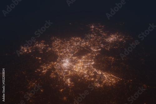 Aerial shot on Raleigh (North Carolina, USA) at night, view from east. Imitation of satellite view on modern city with street lights and glow effect. 3d render