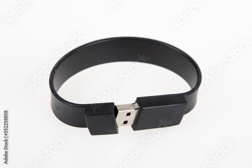Modern armlet key USB Flash drive black like bracelet on white background