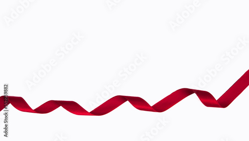 Red color ribbon spiral shape isolated on white background.