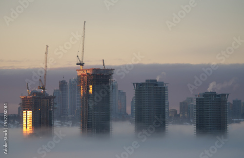 A thick fog blanket covering Metro Vancouver on a winter morning during sunrise in Burnaby, British Columbia, Canada