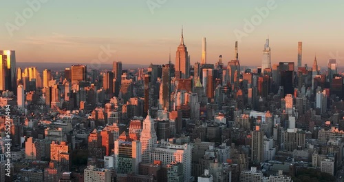 Aerial panorama of  Manhattan tall buildings, New York City at sunset. City skyline panorama
