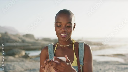 Black woman, phone selfie and happy on beach for content creation, social media posts or change profile picture online. Agrican woman, happiness and blog influencer photography by ocean in summer photo