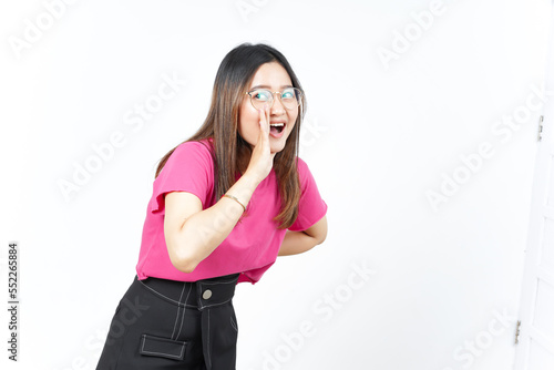 Announcement with hands over mouth Of Beautiful Asian Woman Isolated On White Background