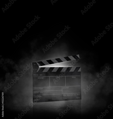 Movie clapper board on black background with smoke