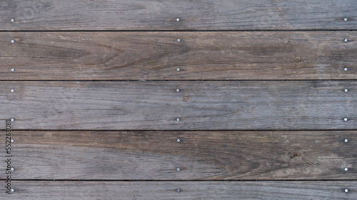 Wooden background made of old wooden planks and nails.