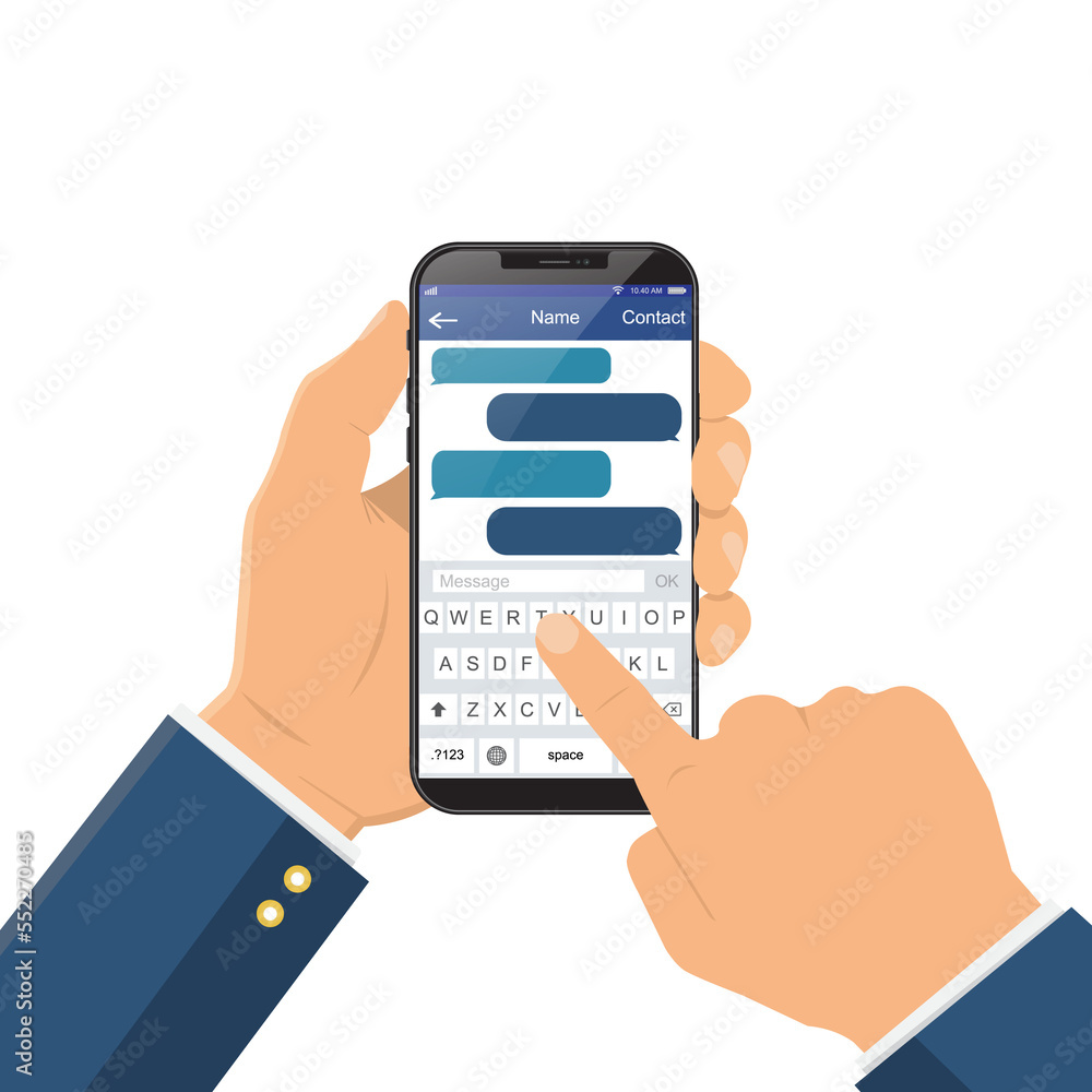 Chat message on the smartphone screen. Hand holds the smartphone, finger touches screen Chat message on the smartphone screen. Hand holds the smartphone, finger touches screen