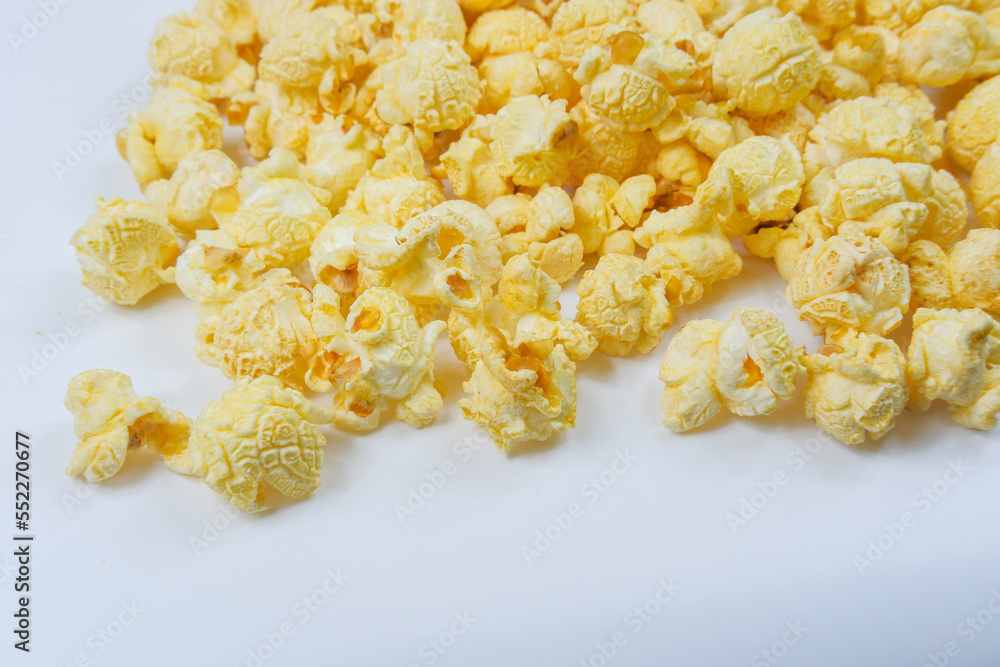 Butter Popcorn scattered on a white background Butter Popcorn scattered on a white background