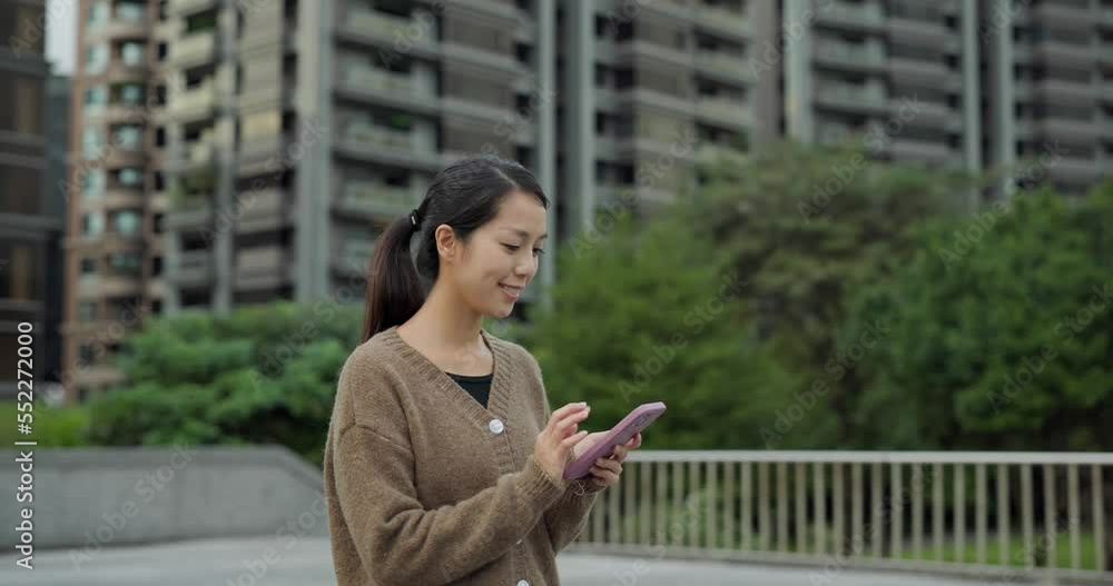Woman use mobile phone in city Woman use mobile phone in city