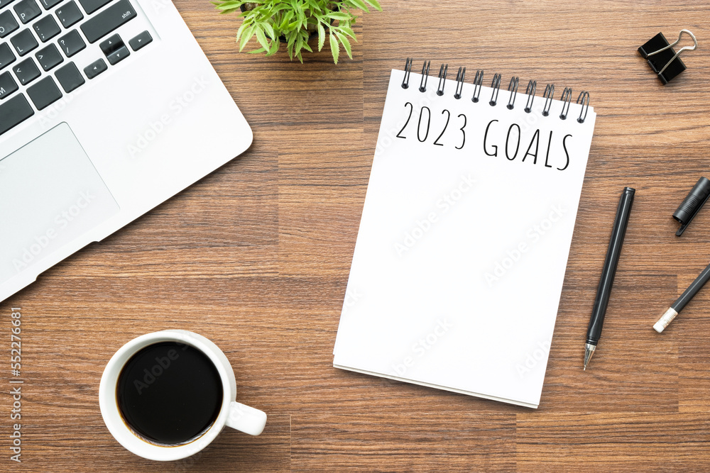 Notebook with 2023 goals text on it to apply new year resolutions and plan. Notebook with 2023 goals text on it to apply new year resolutions and plan.