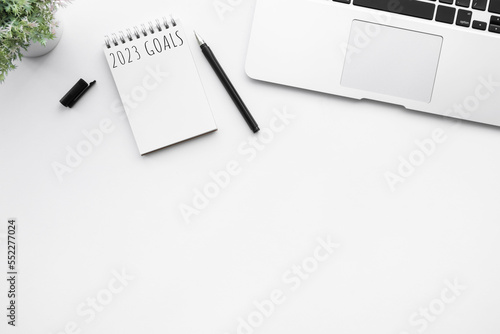 Notebook with 2023 goals text on it to apply new year resolutions and plan.