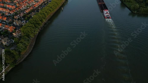 Aerial Flying Over Beneden Merwede With Veerhaven  Barge Travelling Along It. Dolly Forward photo