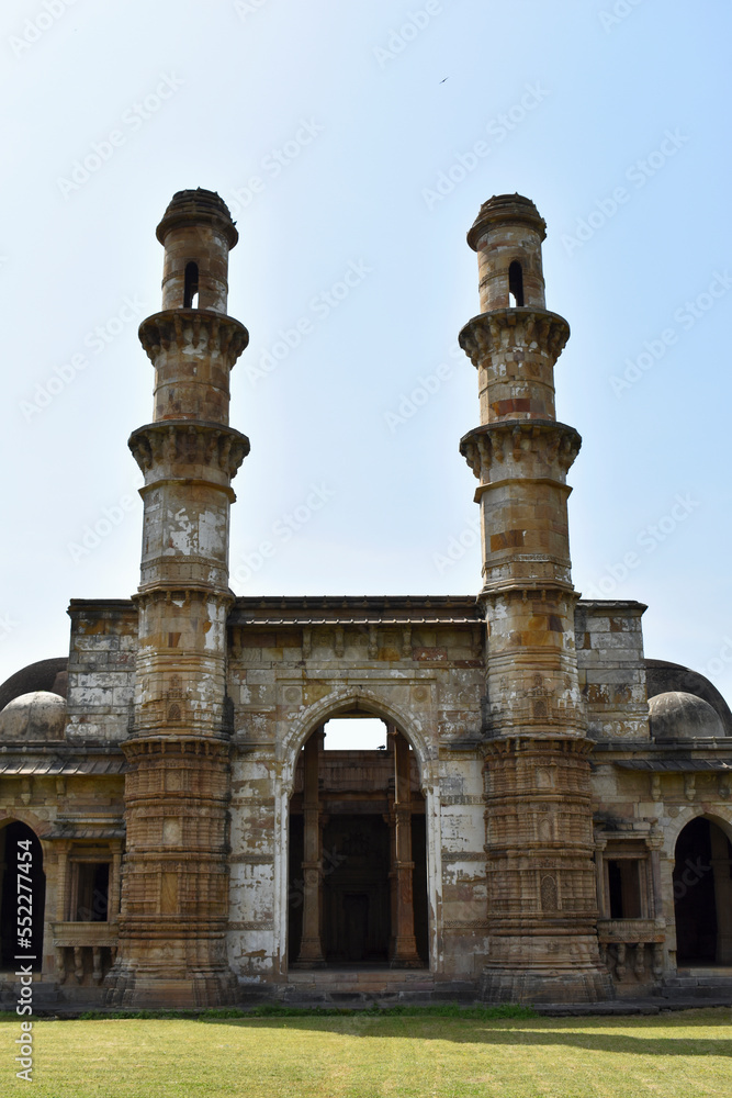 Kevda Masjid with two minarets, built in stone and carvings details of architecture, 15th - 16th century. A UNESCO World Heritage Site, Gujarat, Champaner, India..