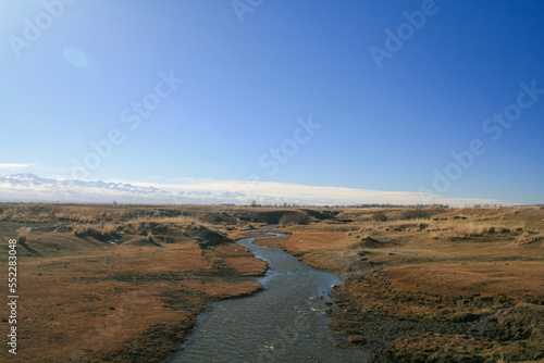 A small river flowing among autumn fields, Kyrgyzstan