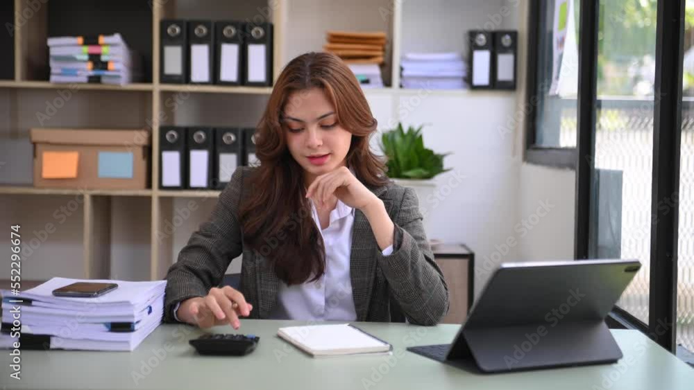 Woman freelancer is working her job on computer tablet and laptop Doing accounting analysis report real estate investment data, Financial Woman freelancer is working her job on computer tablet and laptop Doing accounting analysis report real estate investment data, Financial