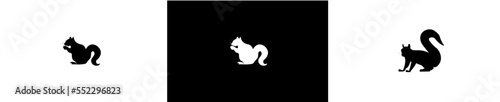 silhouette of squirrel eating acorn and walking.