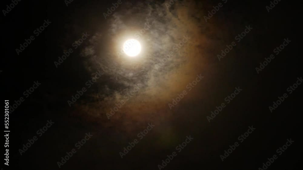 Timelapse full moon clouds float and halo Timelapse full moon clouds float and halo