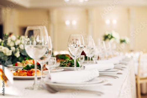 closeup of empty wineglasses on serving table with dishes. weddi
