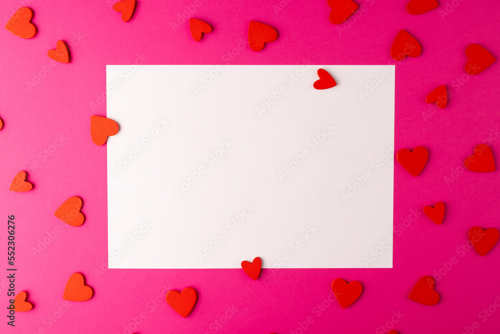 Horizontal white rectangular copy space with red heart shapes on pink background