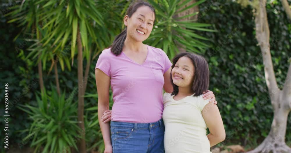 Video of happy asian mother and daughter embracing in garden Video of happy asian mother and daughter embracing in garden