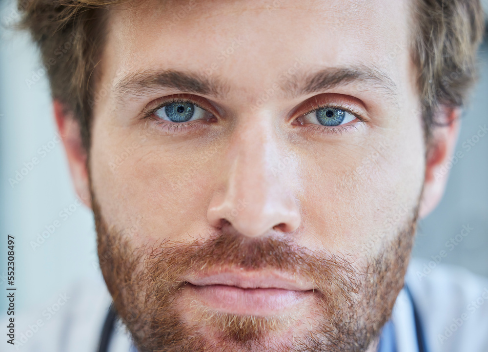 Obraz premium Doctor, face and blue eyes in healthcare, medical or surgeon with vision for insurance at the hospital. Closeup portrait of male nurse professional head or optician ready for eye care or surgery