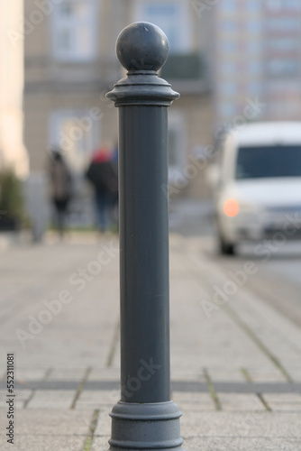 iron post on sidewalk