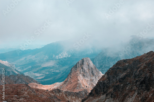 Beautiful mountain range covered with fog