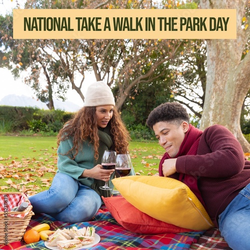 Composition ofnational take a walk in the park day text and couple in park photo