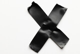 Cross shape black masking tape on white background