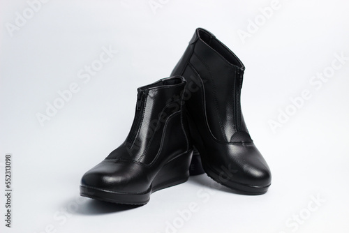 A pair of leather elegant shoes on a white background. Selective focus shoes