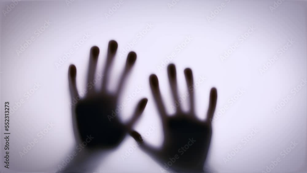 shadows of hands hit the glass. Thriller, horror, violence concept shadows of hands hit the glass. Thriller, horror, violence concept