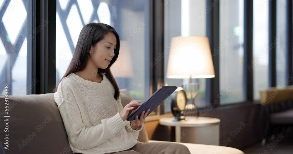 Woman use tablet computer at home Woman use tablet computer at home