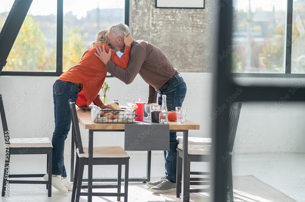 Man hugging his wife while anniversary celebration