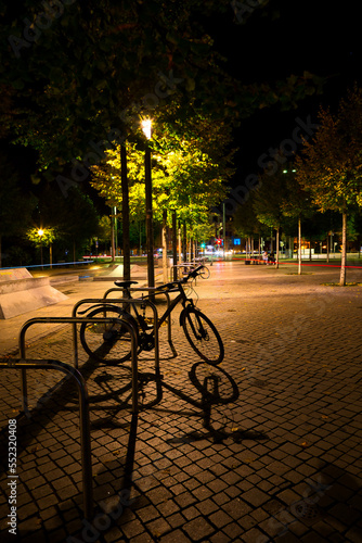 city of Leipzig, germany at night with a bicycle