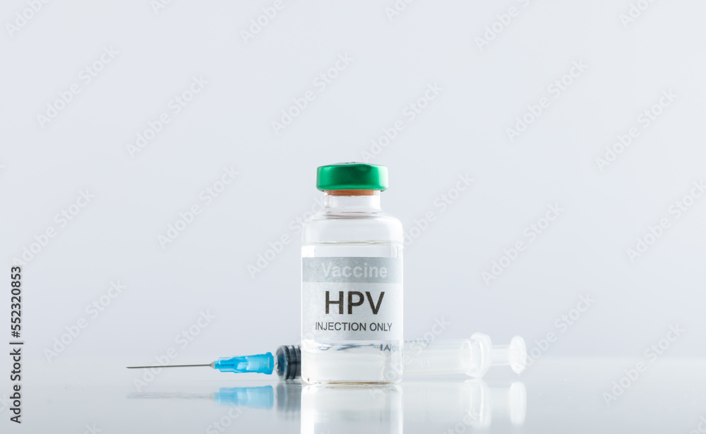 Composition of hpv vaccine vial and syringe on white background with copy space Composition of hpv vaccine vial and syringe on white background with copy space