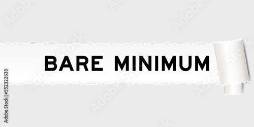 Ripped gray paper background that have word bare minimum under torn part