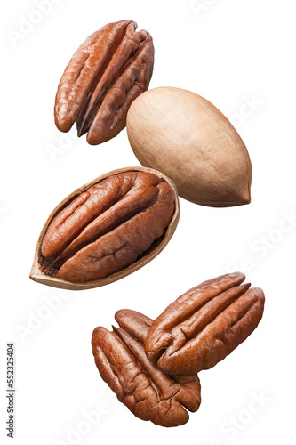 Obraz na płótnie Flying pecan nuts isolated on white background. Vertical layout