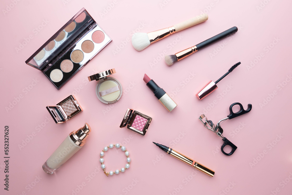 Top view of beauty cosmetic makeup accessories on pink background. Fashion woman make up product, brushes, lipstick, powder, foundation collection. Top view of beauty cosmetic makeup accessories on pink background. Fashion woman make up product, brushes, lipstick, powder, foundation collection.