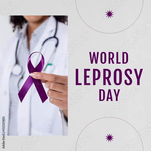 Fotografia Composition of world leprosy day text over biracial female doctor with ribbon
